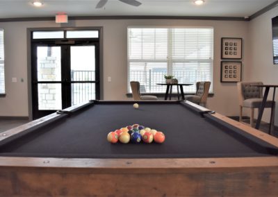 Pool table in the resident community center and lounge at Copper Pointe