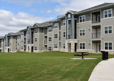 Exterior view of San Antonio, TX apartment residential buildings with outdoor porches