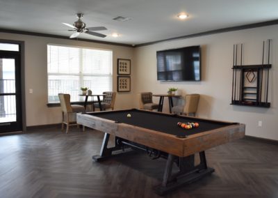 Pool table and television in the Copper Pointe resident lounge